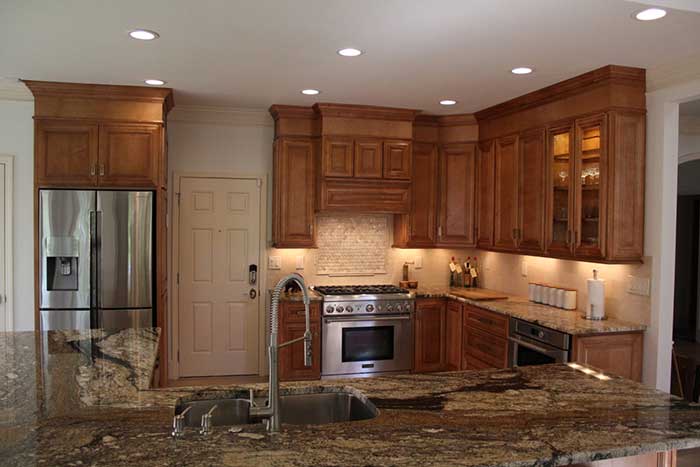 Wooden furniture in kitchen by John Rogers Renovations